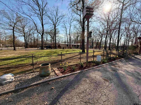 a view of a park with slides and trees