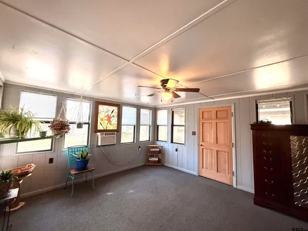 a living room with furniture and windows