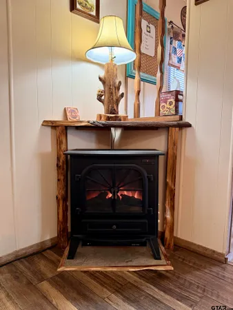 a living room with a fireplace and a table