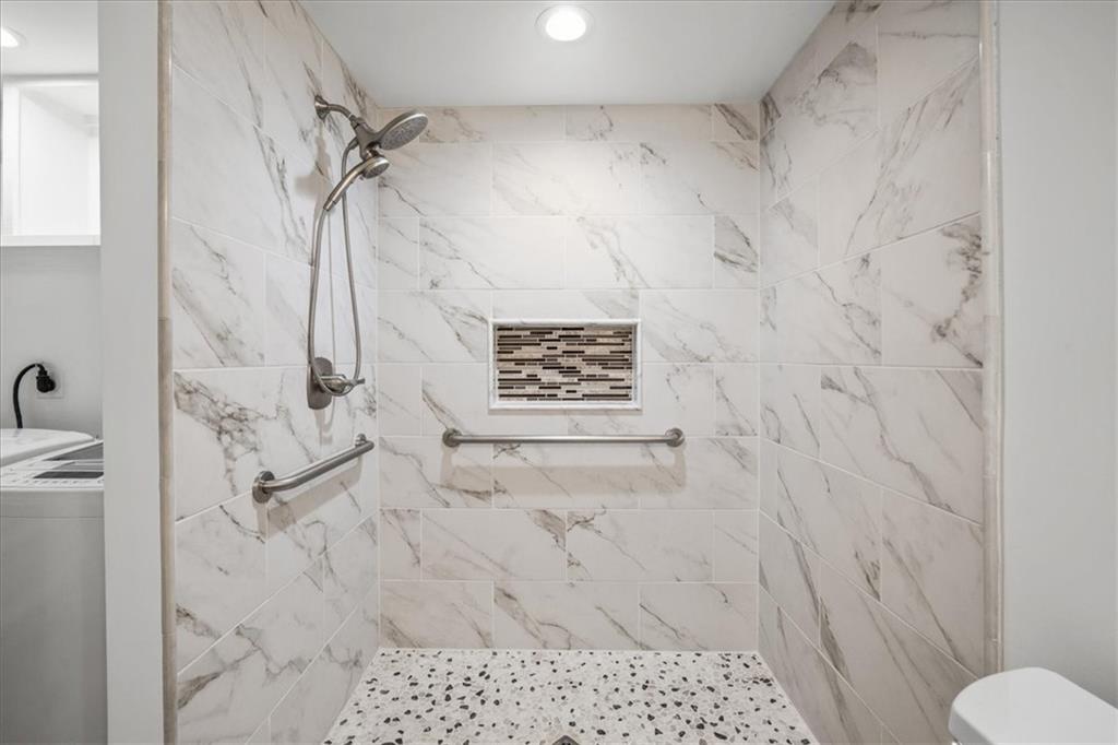 1710 Rising Mist Lane Cumming, GA 30041 - Photo 74 of 111 a bathroom with a shower