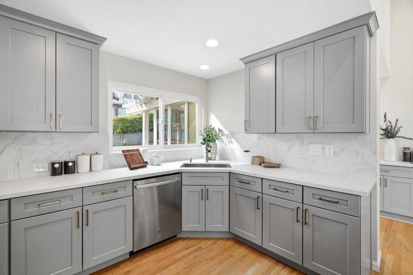 10140 Hillcrest Road Cupertino, CA 95014 - Photo 14 of 39 a kitchen with a sink dishwasher window and cabinets