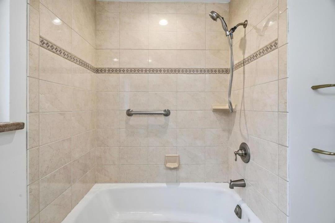 10140 Hillcrest Road Cupertino, CA 95014 - Photo 19 of 39 a bathroom with a bathtub and shower