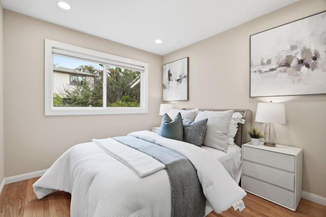 10140 Hillcrest Road Cupertino, CA 95014 - Photo 20 of 39 a bedroom with a large bed and a window