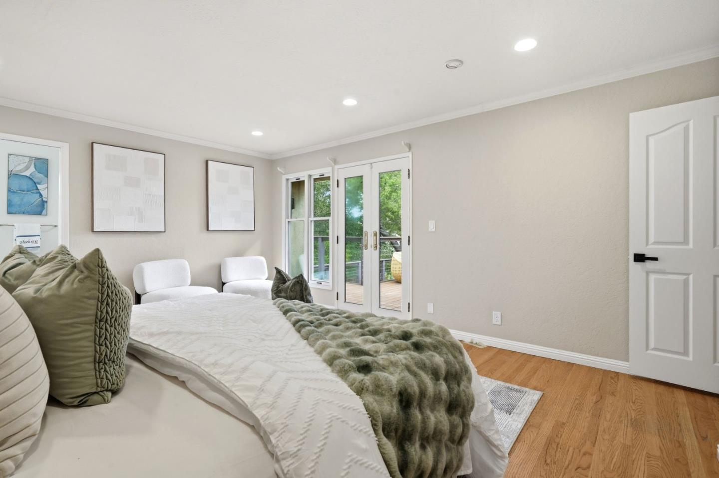 10140 Hillcrest Road Cupertino, CA 95014 - Photo 23 of 39 a spacious bedroom with a bed and a large window