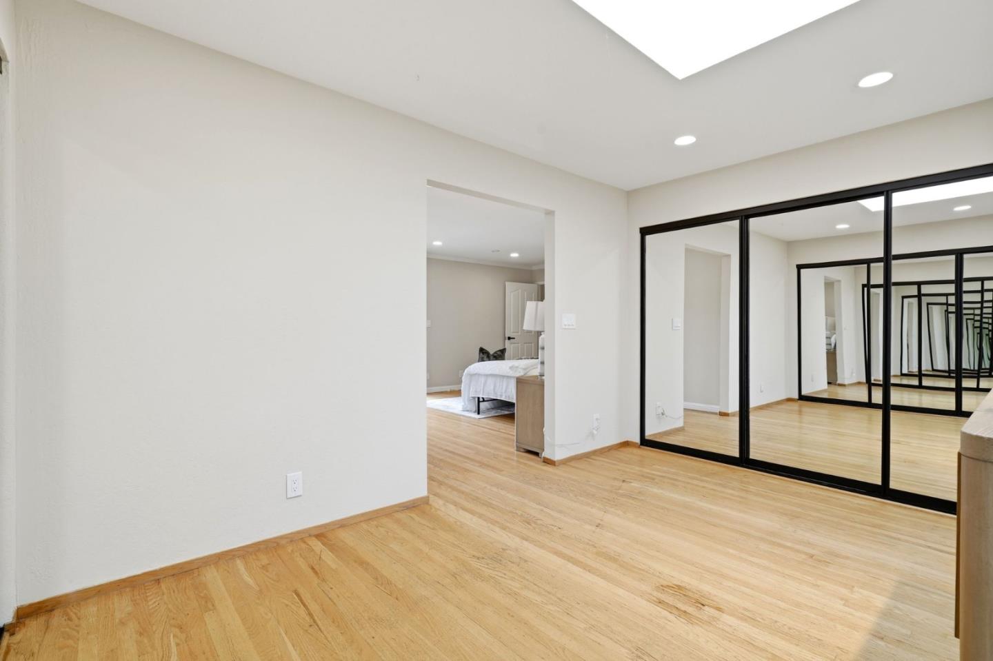 10140 Hillcrest Road Cupertino, CA 95014 - Photo 26 of 39 a view of a livingroom with wooden floor and white floor