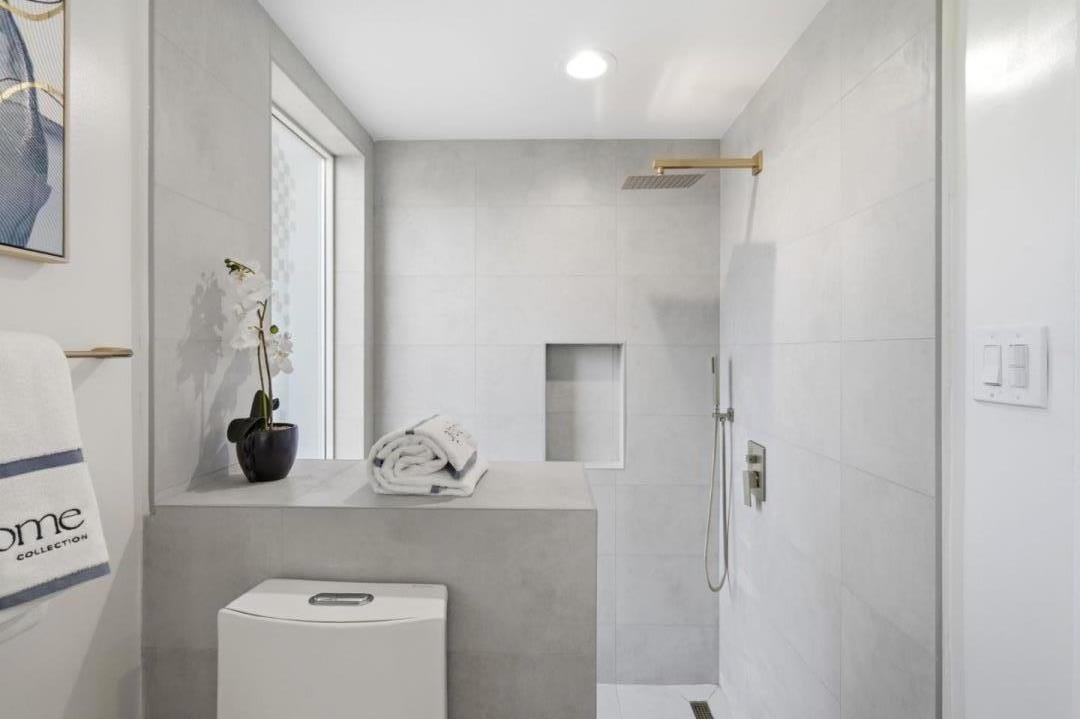 10140 Hillcrest Road Cupertino, CA 95014 - Photo 28 of 39 a bathroom with a shower sink and toilet