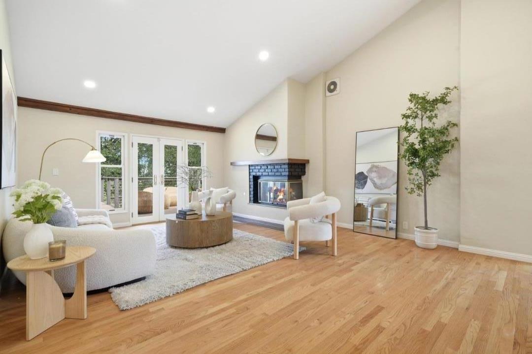 10140 Hillcrest Road Cupertino, CA 95014 - Photo 3 of 39 a living room with fireplace furniture and a wooden floor