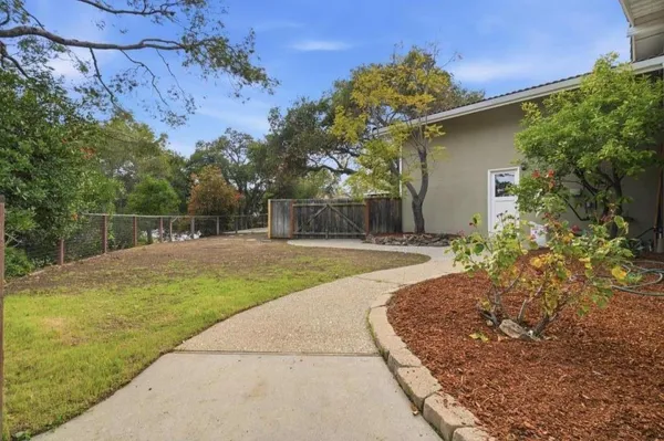 a swimming pool with wooden fence