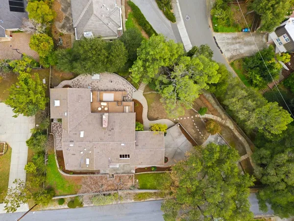 an aerial view of residential houses with outdoor space