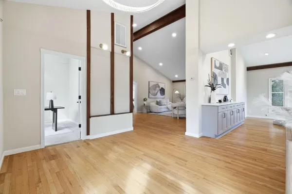 a view of kitchen and hall with wooden floor