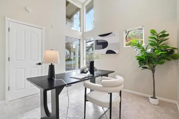 a view of kitchen with furniture and chandelier