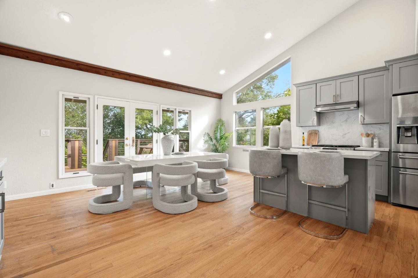 10140 Hillcrest Road Cupertino, CA 95014 - Photo 10 of 39 a living room with furniture and large windows