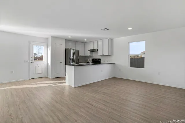 a view of a kitchen with a sink cabinets and a window
