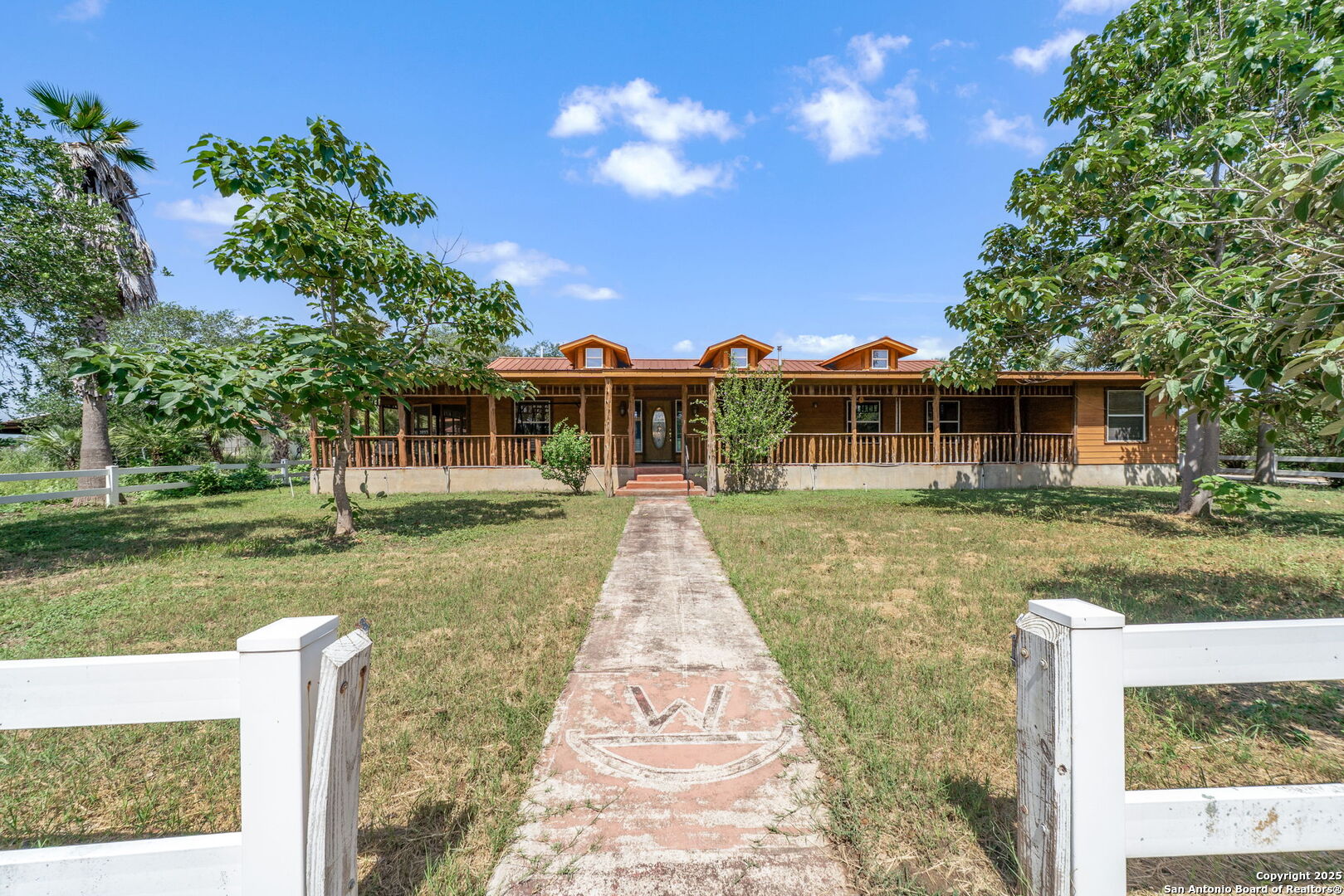 1551 North Windy Knoll Drive Devine, TX 78016 - Photo 13 of 42 a view of a house with a yard