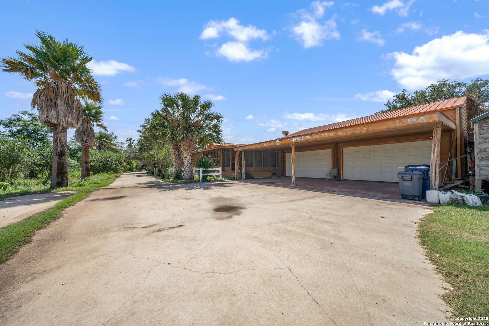 1551 North Windy Knoll Drive Devine, TX 78016 - Photo 14 of 42 a view of a house with a yard and garage