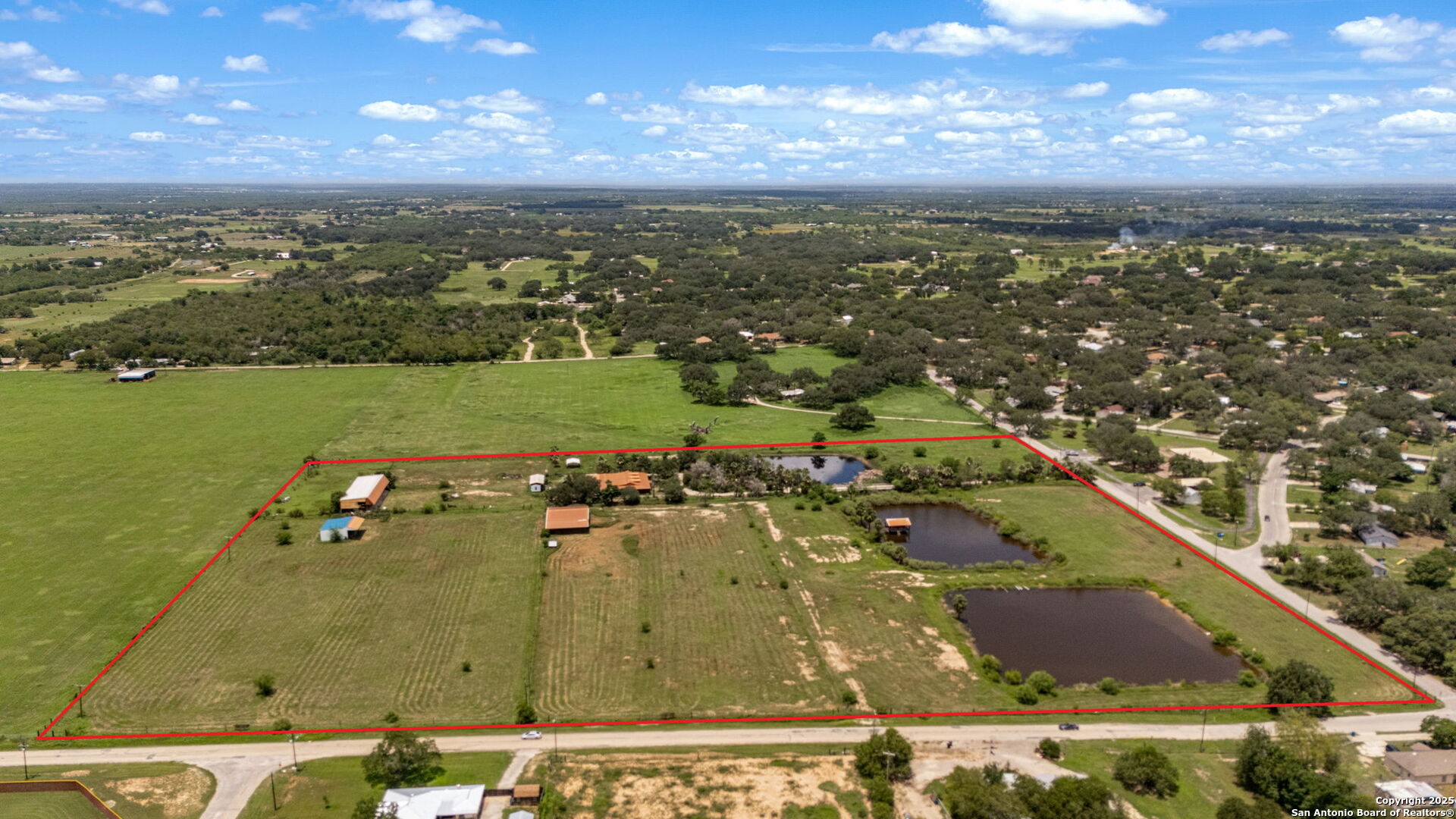1551 North Windy Knoll Drive Devine, TX 78016 - Photo 2 of 42 an aerial view of residential building and ocean