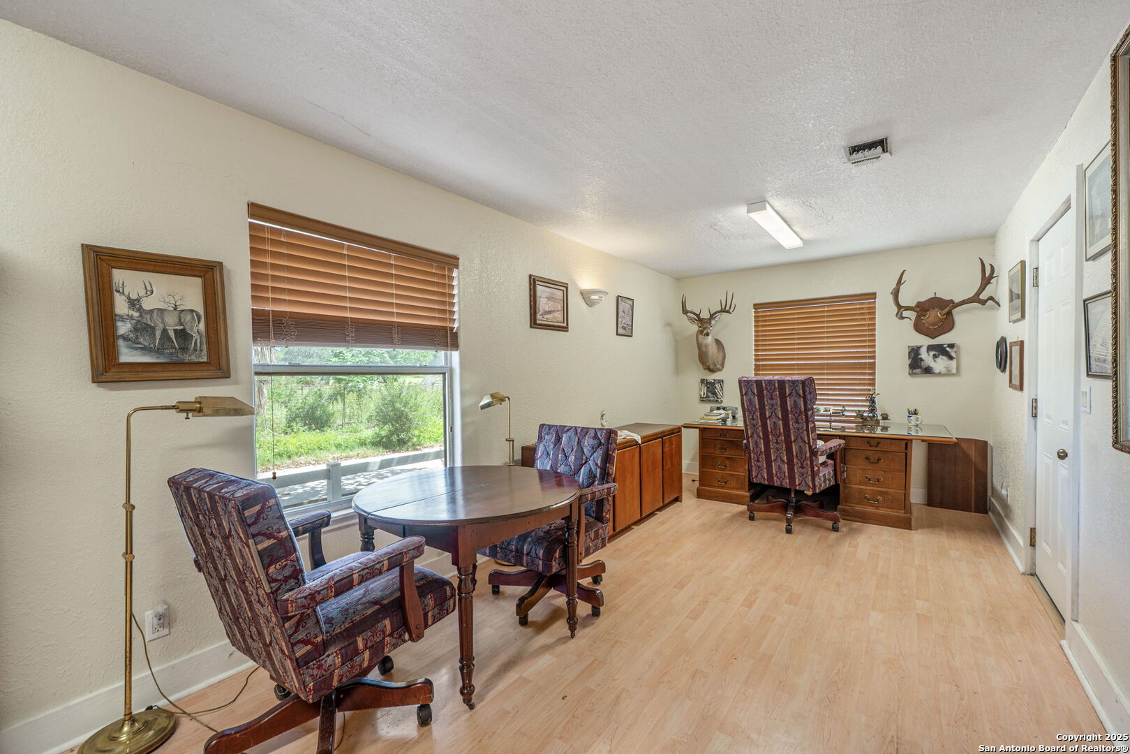 1551 North Windy Knoll Drive Devine, TX 78016 - Photo 26 of 42 a view of a livingroom with furniture and a window