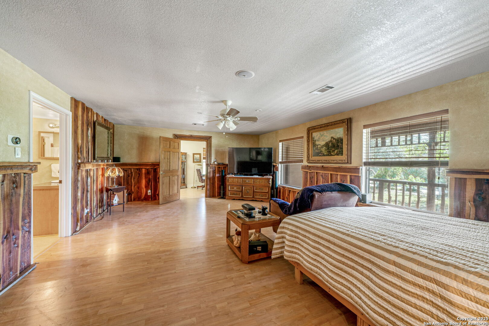 1551 North Windy Knoll Drive Devine, TX 78016 - Photo 27 of 42 a bedroom with furniture and a large window