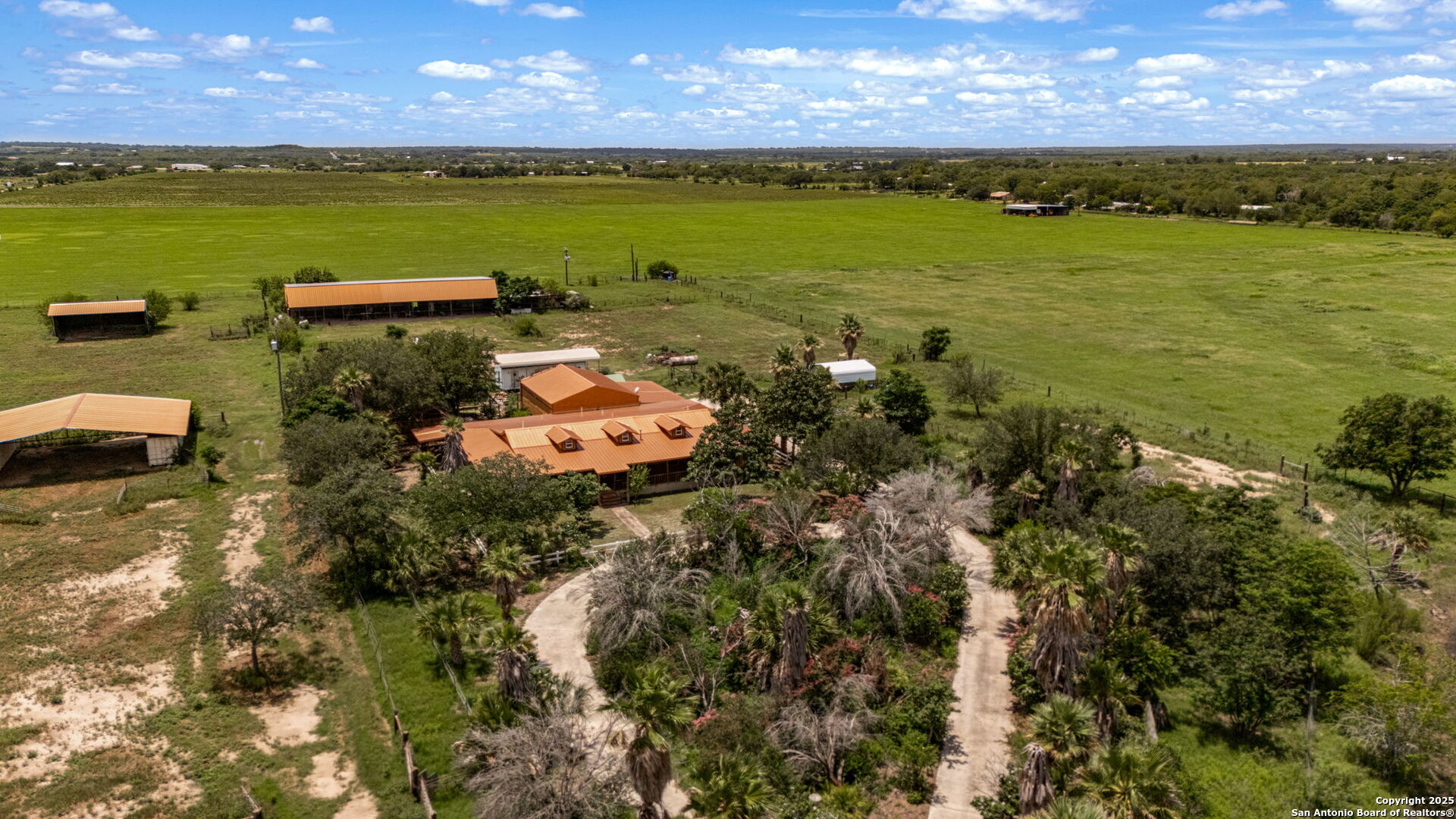 1551 North Windy Knoll Drive Devine, TX 78016 - Photo 6 of 42 an aerial view of a houses with a lake view