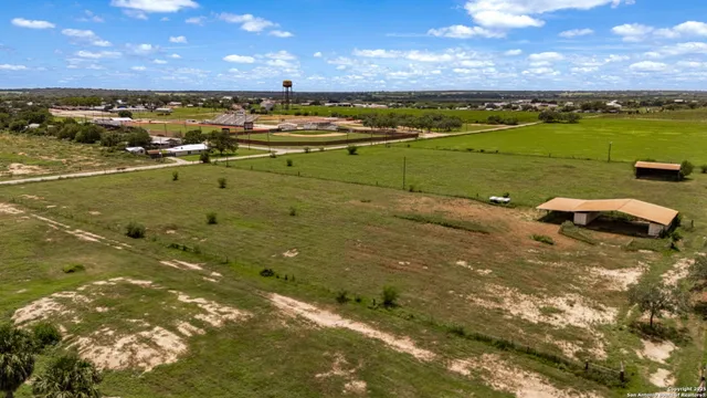 an aerial view of a house with a lake view