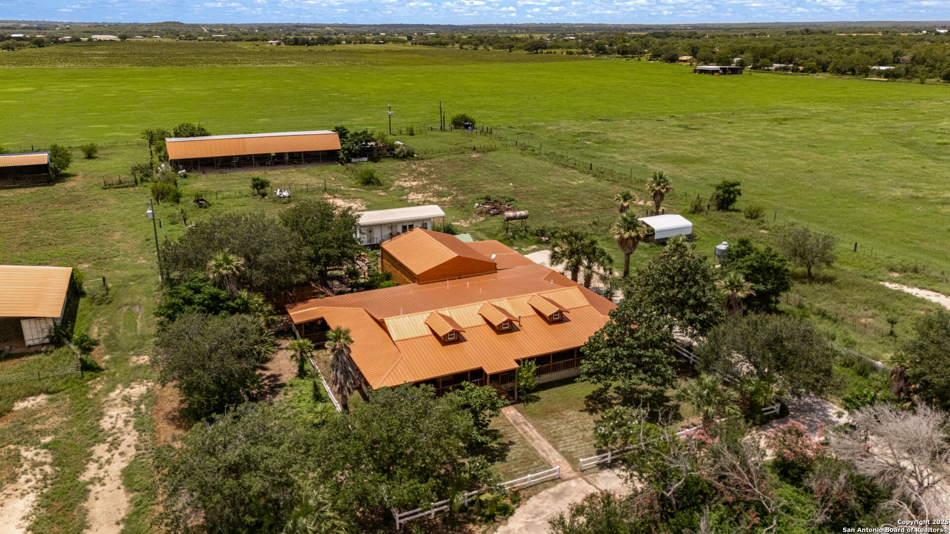 1551 North Windy Knoll Drive Devine, TX 78016 - Photo 8 of 42 an aerial view of a house with a lake view