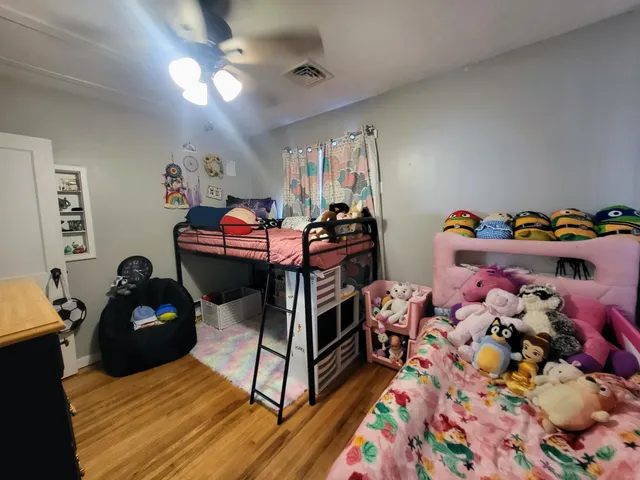 a bathroom with a sink mirror vanity and toilet