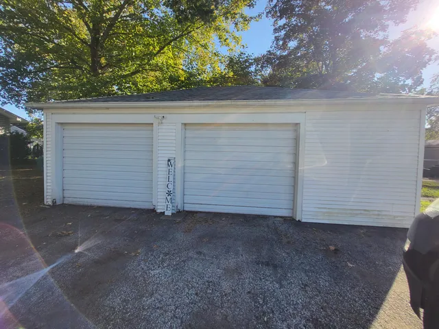 a view of backyard and garage