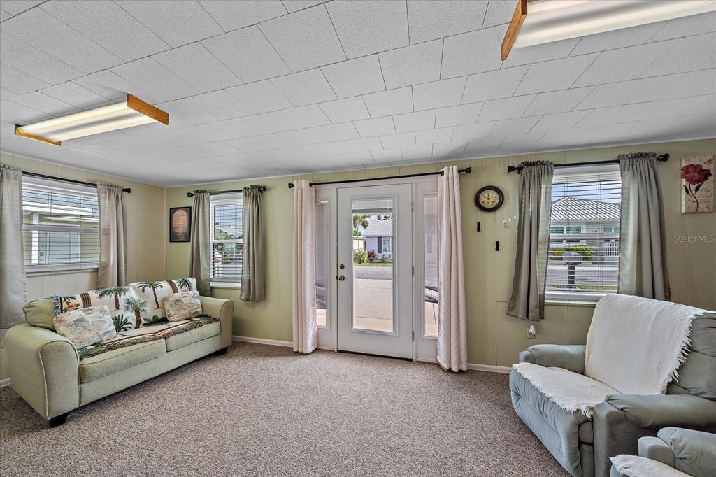 1260 Yoder Avenue Sarasota, FL 34239 - Photo 14 of 42 a living room with furniture and a large window