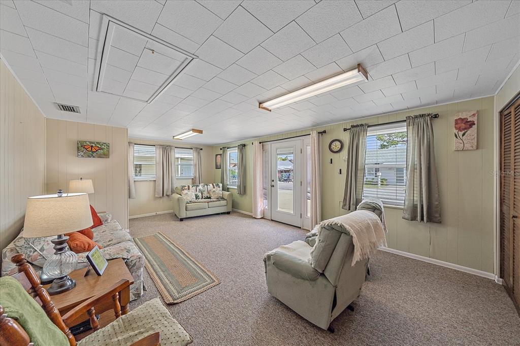 1260 Yoder Avenue Sarasota, FL 34239 - Photo 16 of 42 a living room with furniture and a large window