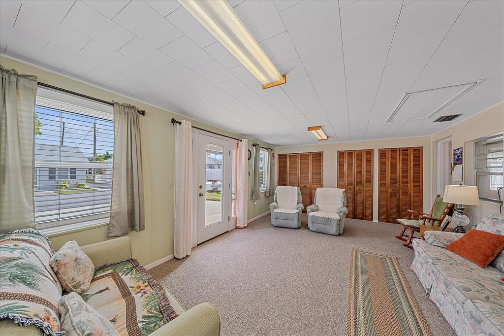 1260 Yoder Avenue Sarasota, FL 34239 - Photo 17 of 42 a living room with furniture floor to ceiling window