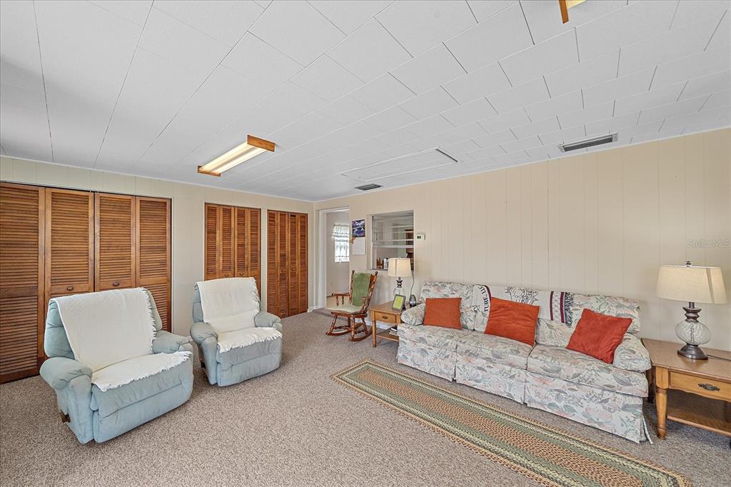 1260 Yoder Avenue Sarasota, FL 34239 - Photo 18 of 42 a living room with furniture and a large window