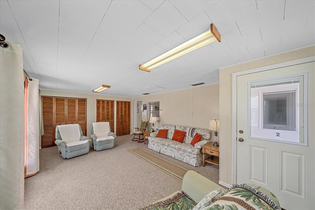 1260 Yoder Avenue Sarasota, FL 34239 - Photo 19 of 42 a bedroom with furniture and a large window