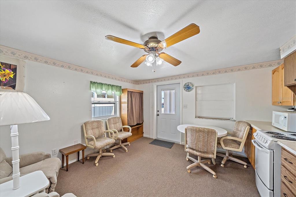 1260 Yoder Avenue Sarasota, FL 34239 - Photo 21 of 42 a living room with furniture and a window