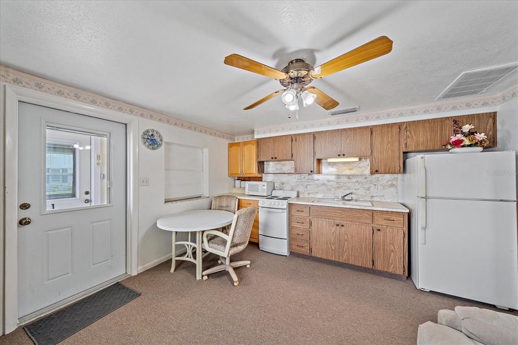 1260 Yoder Avenue Sarasota, FL 34239 - Photo 25 of 42 a dining room with furniture and window