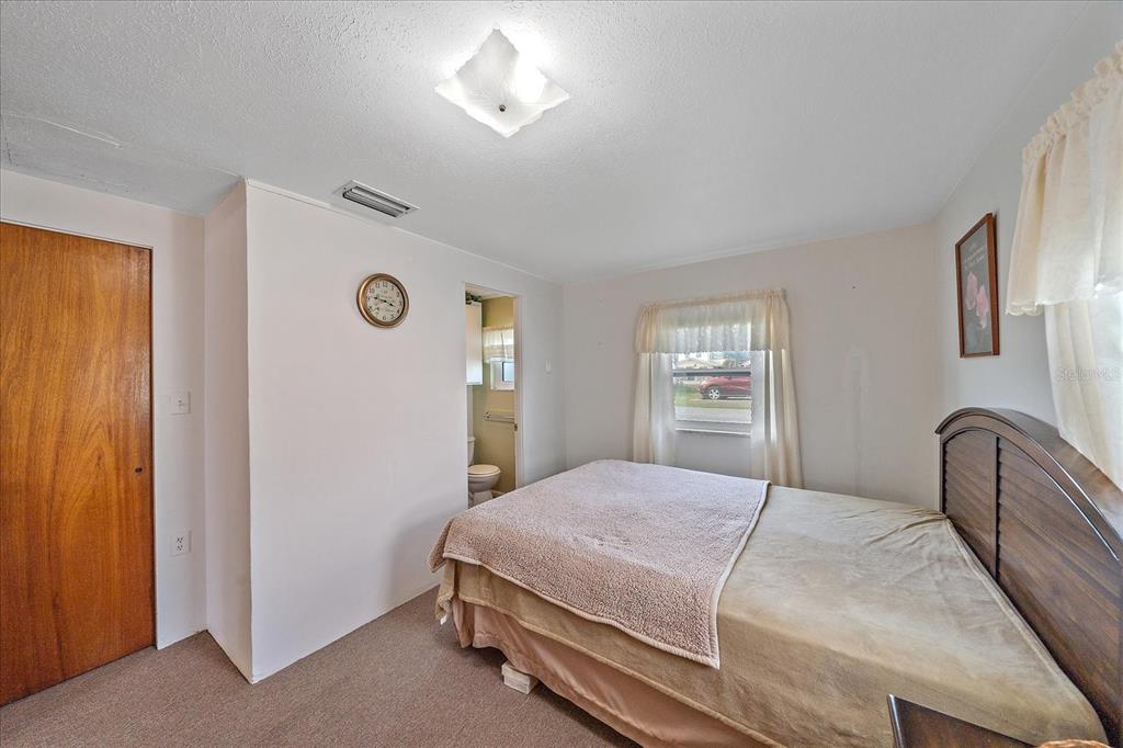 1260 Yoder Avenue Sarasota, FL 34239 - Photo 27 of 42 a bedroom with a bed and a window