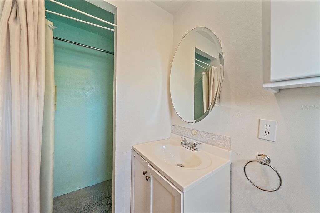1260 Yoder Avenue Sarasota, FL 34239 - Photo 29 of 42 a bathroom with a sink and a mirror