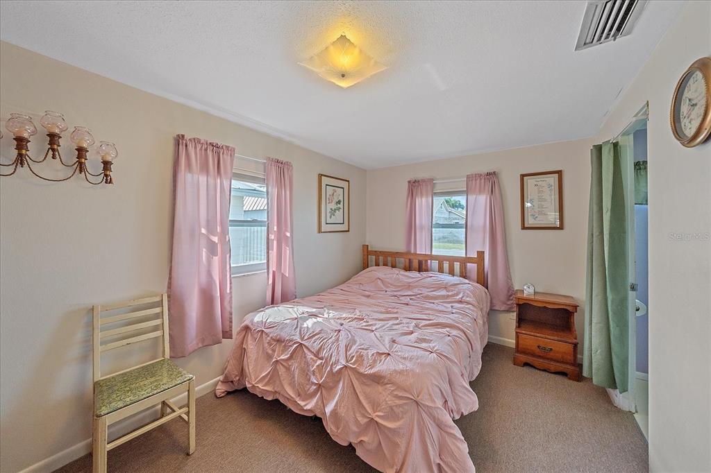 1260 Yoder Avenue Sarasota, FL 34239 - Photo 30 of 42 a bedroom with a bed and a window