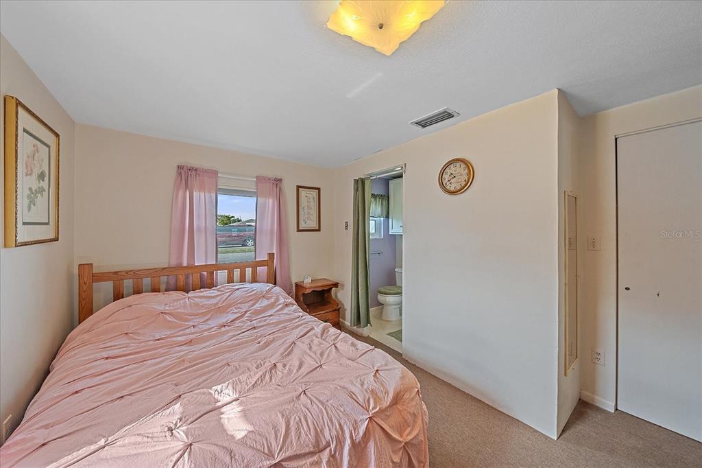 1260 Yoder Avenue Sarasota, FL 34239 - Photo 32 of 42 a bedroom with a bed and a window