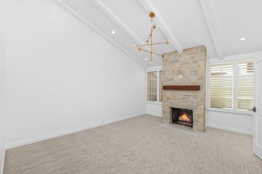 6125 La Flecha Rancho Santa Fe, CA 92067 - Photo 11 of 20 a view of empty room with fireplace and wooden floor
