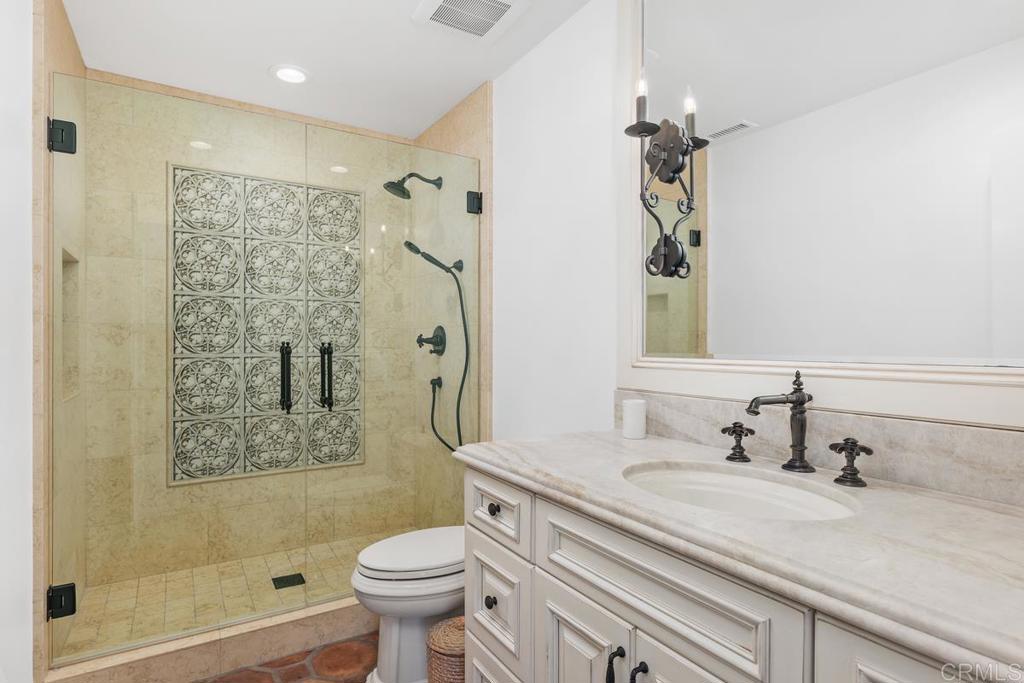 6125 La Flecha Rancho Santa Fe, CA 92067 - Photo 15 of 20 a bathroom with a sink a toilet and shower