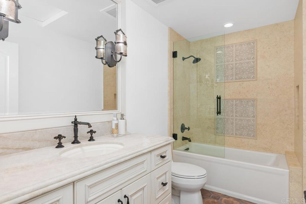 6125 La Flecha Rancho Santa Fe, CA 92067 - Photo 17 of 20 a bathroom with a sink a toilet and a mirror