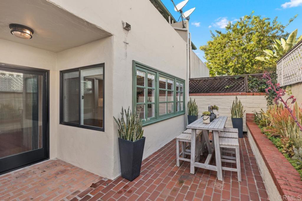 6125 La Flecha Rancho Santa Fe, CA 92067 - Photo 18 of 20 a outdoor space with a wooden table and chairs