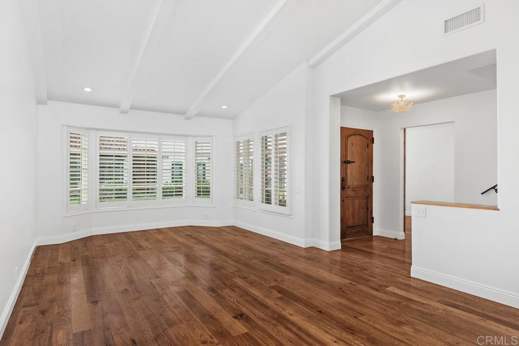 6125 La Flecha Rancho Santa Fe, CA 92067 - Photo 3 of 20 a view of an empty room with wooden floor and a window