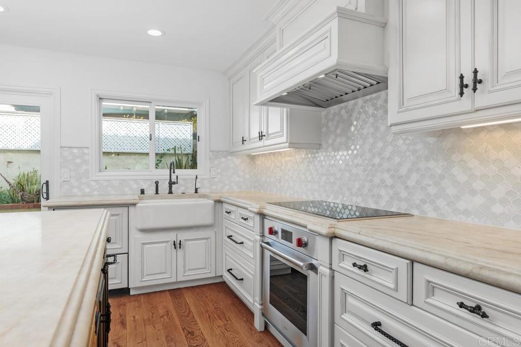 6125 La Flecha Rancho Santa Fe, CA 92067 - Photo 6 of 20 a kitchen with granite countertop a sink stainless steel appliances and cabinets
