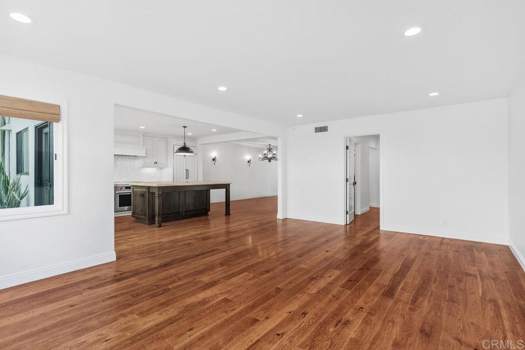 6125 La Flecha Rancho Santa Fe, CA 92067 - Photo 8 of 20 a view of a big room with wooden floor and windows