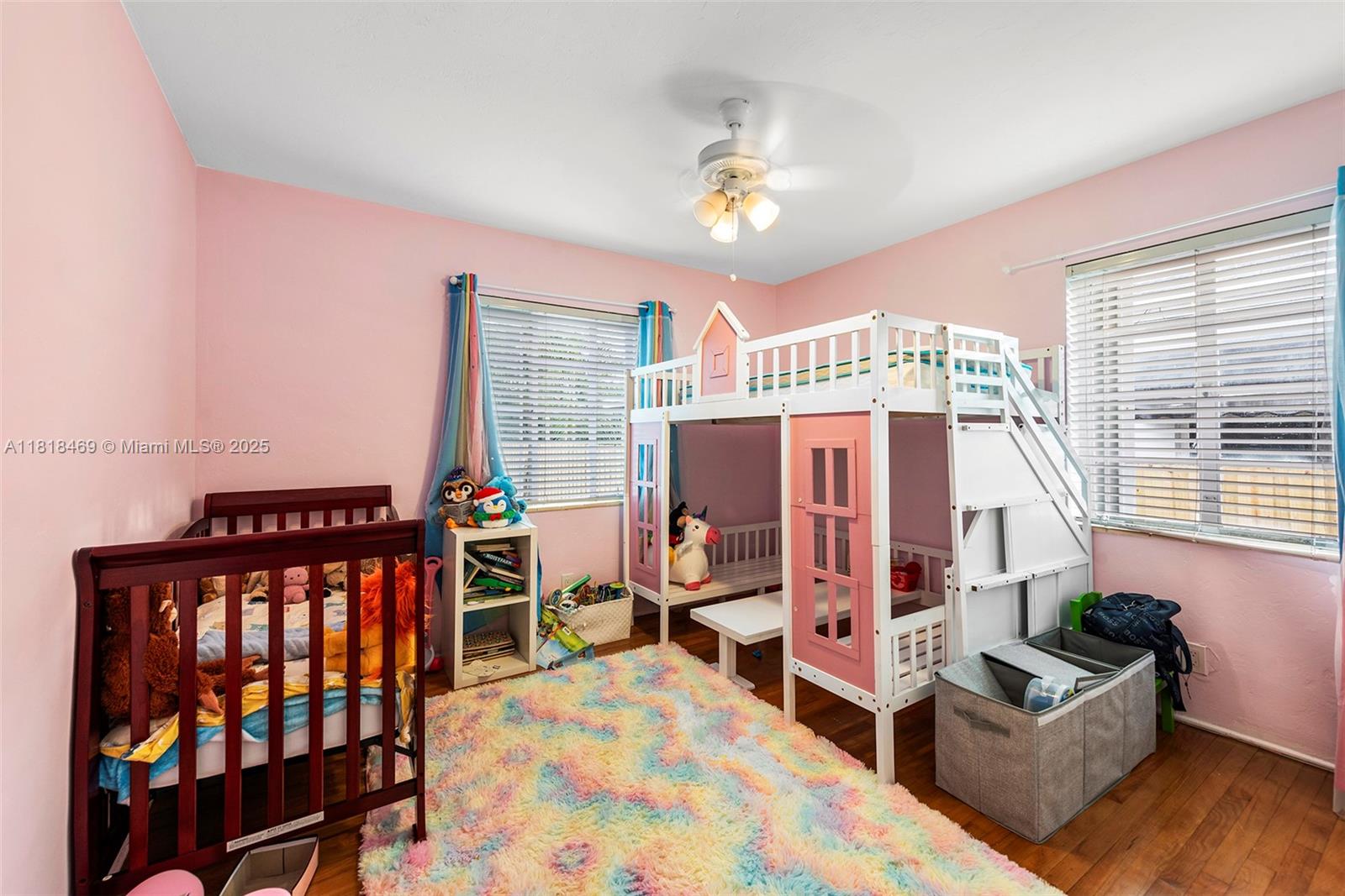 1545 Normandy Drive Miami Beach, FL 33141 - Photo 12 of 37 a bedroom with furniture and a large window