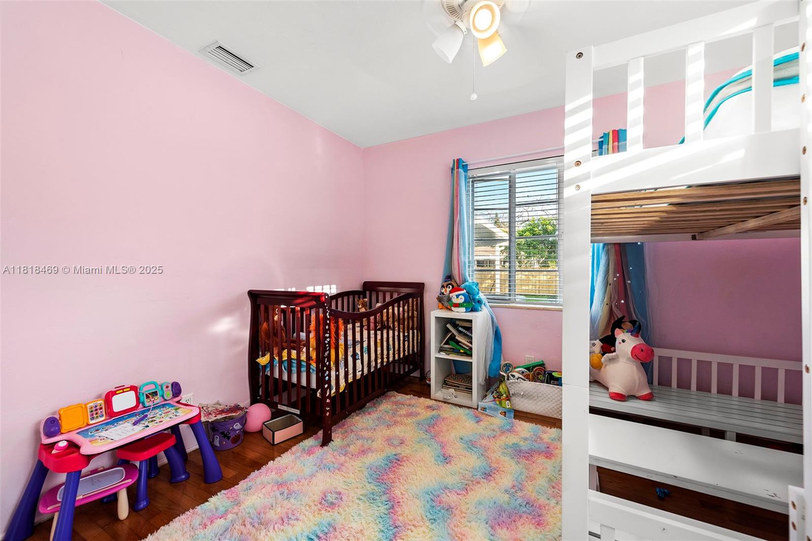 1545 Normandy Drive Miami Beach, FL 33141 - Photo 14 of 37 a bedroom with furniture and a window