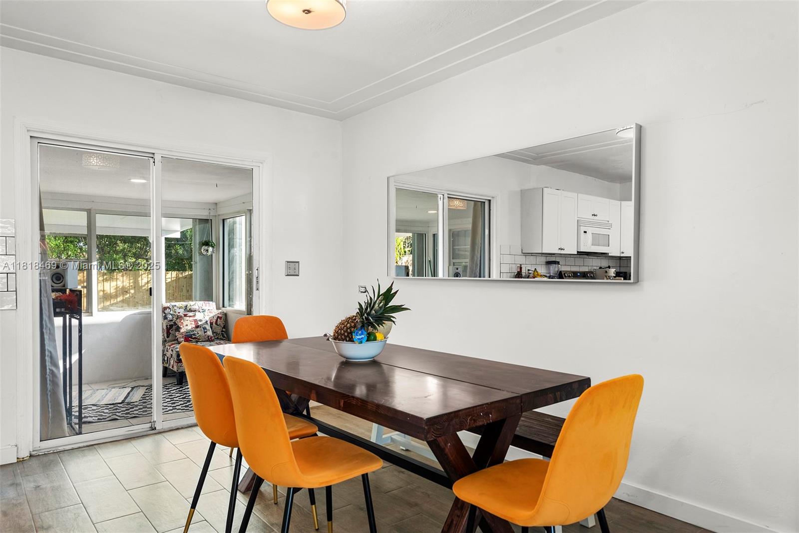1545 Normandy Drive Miami Beach, FL 33141 - Photo 26 of 37 a dining room with furniture and wooden floor