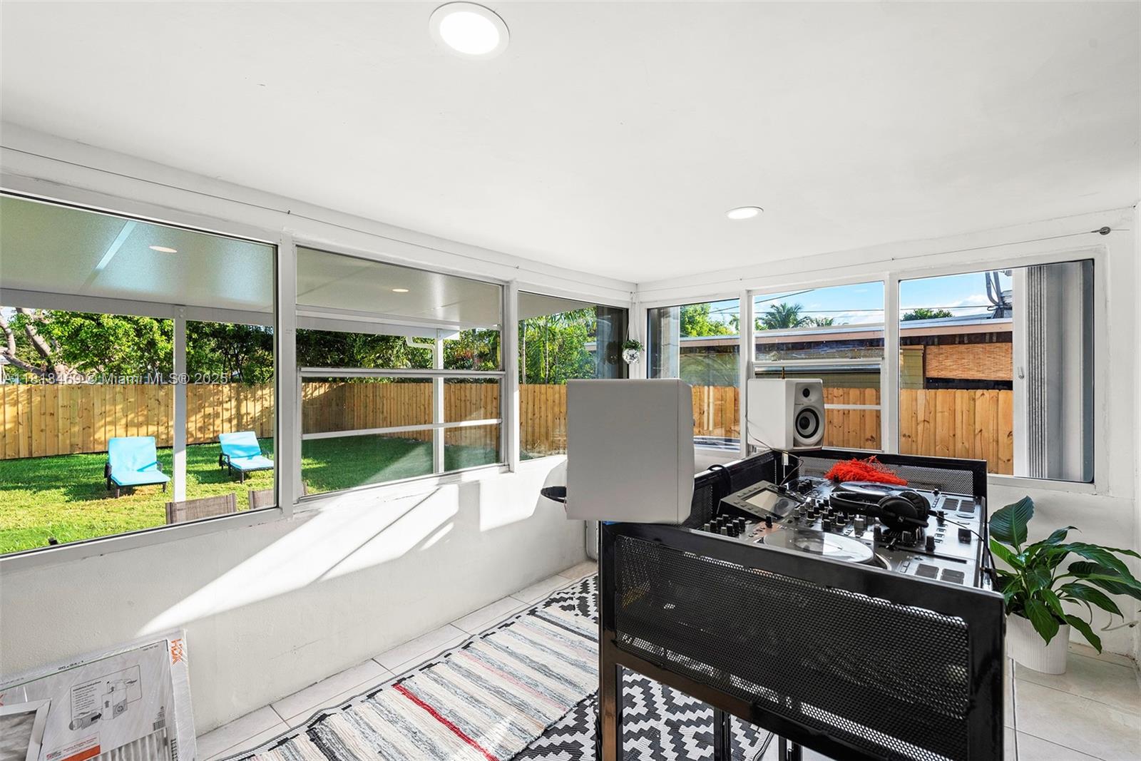 1545 Normandy Drive Miami Beach, FL 33141 - Photo 28 of 37 a living room with furniture fireplace and a large window