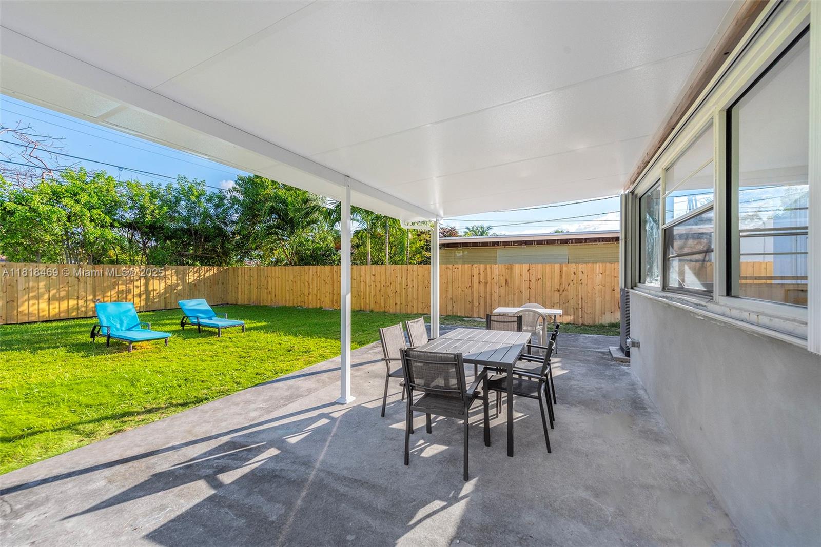 1545 Normandy Drive Miami Beach, FL 33141 - Photo 29 of 37 a view of a patio with a table and chairs